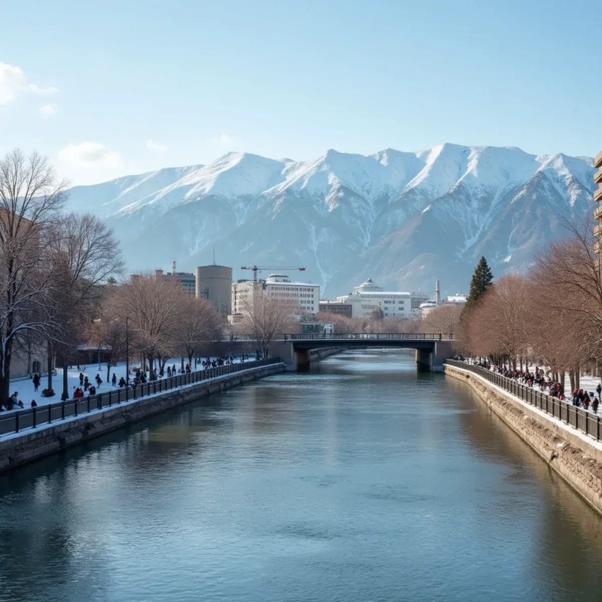 Las Vegas to Reno: Reno Riverwalk on the Truckee River with the Sierra Nevada behind, winter snow on the peaks